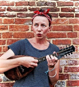 Dr. Freya Cox Jensen playing the mandolin.