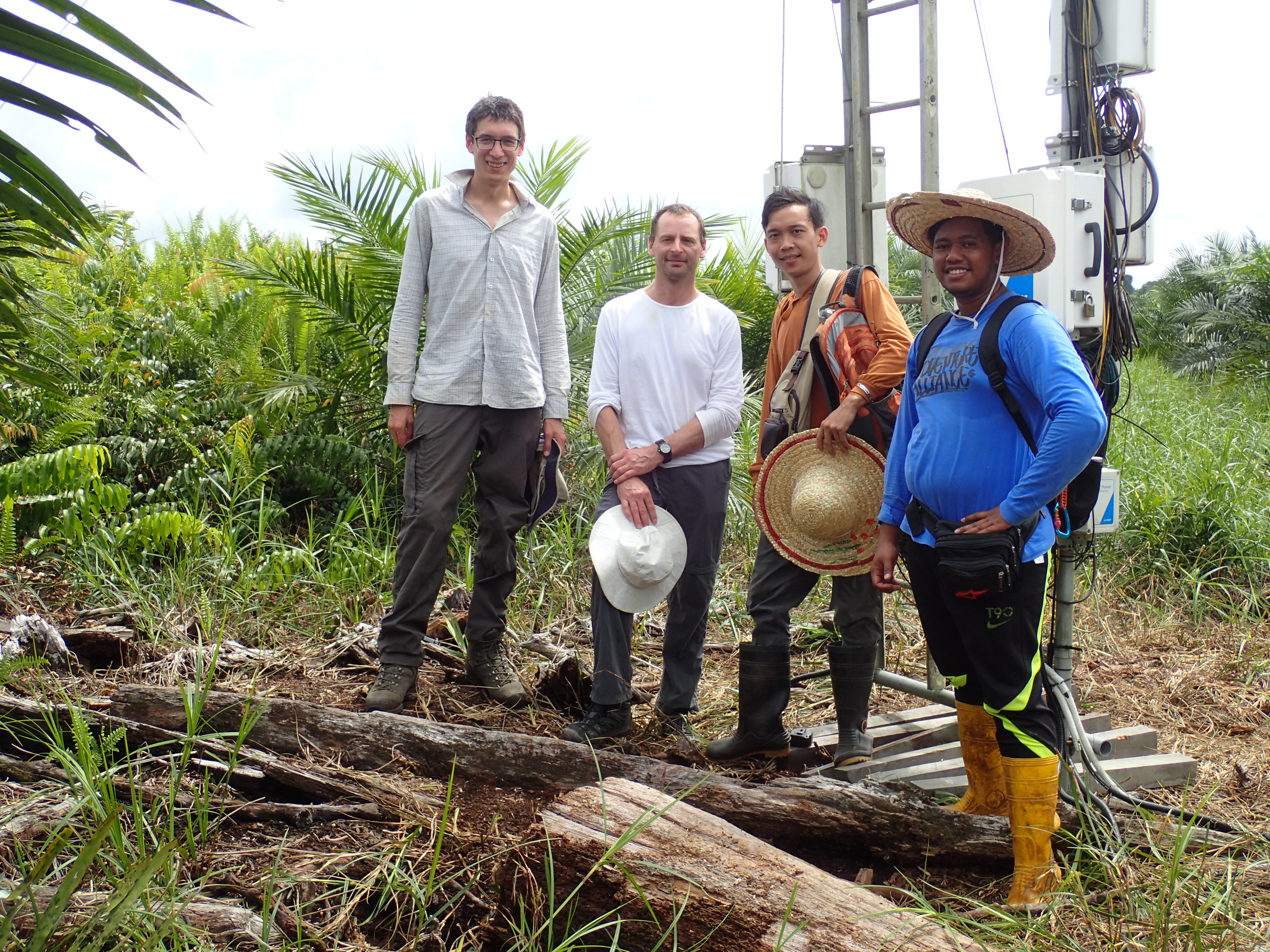 Tim Hill, Jon McCalmont, Ham and Jai at the recently converted oil palm site