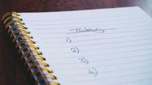 A picture of a To Do list in a wire-bound notebook, with numbers from one to four listed.